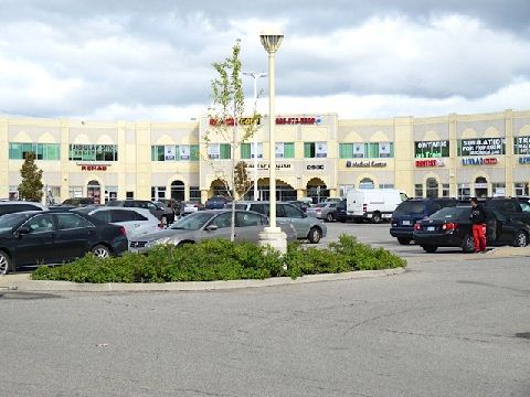 Leo_-_Front_Distant_Exposure_of_Bldg_AND_Parking_Lot.jpg