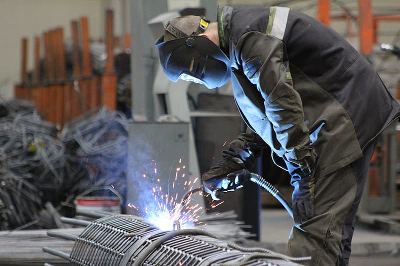 man-in-black-and-white-suit-with-welding-mask.jpg